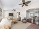 Inviting space with large ceilings, comfortable seating, and seamless flow to dining area at 628 San Pedro Dr, The Villages, FL 32159