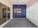 Enclosed sunroom with carpet, sliding glass door and blue accent wall at 628 San Pedro Dr, The Villages, FL 32159