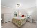 Inviting bedroom boasts natural light, neutral carpeting and a light, airy ambiance at 654 Poinsett Ct, The Villages, FL 32162