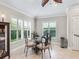 Cozy breakfast nook with natural light, plantation shutters, and stylish furniture at 654 Poinsett Ct, The Villages, FL 32162