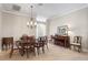 Elegant dining room with tile flooring, chandelier, and comfortable seating at 654 Poinsett Ct, The Villages, FL 32162
