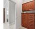 Hallway with wooden cabinets and drawers at 654 Poinsett Ct, The Villages, FL 32162