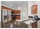 Kitchen features granite countertops, stainless steel appliances and wood cabinetry at 654 Poinsett Ct, The Villages, FL 32162