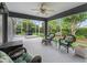 Covered lanai featuring outdoor seating and lush green views at 654 Poinsett Ct, The Villages, FL 32162