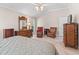 Spacious bedroom with high ceilings, lots of seating, and beautiful natural light at 654 Poinsett Ct, The Villages, FL 32162