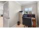 Compact office space with functional desk, filing cabinet, and window view at 654 Poinsett Ct, The Villages, FL 32162