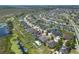 Aerial view featuring a well-planned community with homes and some with solar at 686 Black Eagle Dr, Groveland, FL 34736