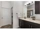 Bright bathroom with double vanity, granite countertop, and modern fixtures and finishes at 686 Black Eagle Dr, Groveland, FL 34736