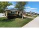 Well-maintained single-Gathering home with a two-car garage, manicured lawn, and established landscaping at 686 Black Eagle Dr, Groveland, FL 34736