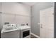 Practical laundry room featuring modern appliances and ample space for chores at 686 Black Eagle Dr, Groveland, FL 34736