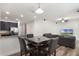 Inviting living area featuring a dining table, seamless access to the kitchen, and a spacious living room with stylish décor at 686 Black Eagle Dr, Groveland, FL 34736