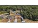 Aerial view of a charming home surrounded by trees and with a well-maintained yard at 7162 Se 124Th St, Belleview, FL 34420