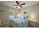 Bedroom featuring a ceiling fan, comfortable bed and lots of natural light at 7162 Se 124Th St, Belleview, FL 34420