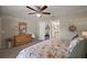 Bright bedroom boasts floral bedding, decorative accents, and ample space at 7162 Se 124Th St, Belleview, FL 34420