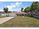 Charming single-story home with an attached garage and an RV parked on the side yard at 7162 Se 124Th St, Belleview, FL 34420