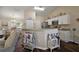 Bright kitchen features granite countertops, stainless steel appliances, and white cabinetry at 7162 Se 124Th St, Belleview, FL 34420