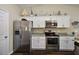 Bright kitchen featuring granite countertops and stainless steel appliances at 7162 Se 124Th St, Belleview, FL 34420