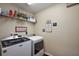 Functional laundry room equipped with modern washer and dryer at 7162 Se 124Th St, Belleview, FL 34420
