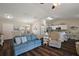 Open-concept living room featuring wood floors, and a kitchen and breakfast nook at 7162 Se 124Th St, Belleview, FL 34420