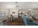 Open concept living area with wood floors, dining area, and living area with lots of natural light at 7162 Se 124Th St, Belleview, FL 34420