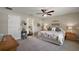 Serene main bedroom with ensuite bath and ceiling fan at 7162 Se 124Th St, Belleview, FL 34420