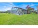 Expansive backyard view of the screened-in pool and patio area, perfect for entertaining at 802 Balmoral Dr, Davenport, FL 33896