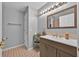 Bathroom featuring a vanity with storage and updated mirror and lighting at 802 Balmoral Dr, Davenport, FL 33896