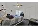 Bedroom with two beds, dark wood floors, and a closet, offering a comfortable living space at 802 Balmoral Dr, Davenport, FL 33896