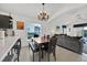 Bright dining area with a chandelier, open to the kitchen and living room at 802 Balmoral Dr, Davenport, FL 33896