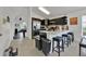 Modern kitchen with stainless steel appliances, breakfast bar, and views into the game room at 802 Balmoral Dr, Davenport, FL 33896