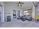 Covered outdoor patio featuring comfortable seating and a mini-refrigerator at 802 Balmoral Dr, Davenport, FL 33896