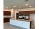 Beautiful kitchen with granite countertops, a large island, and stainless steel microwave at 8855 Sw 72Nd Loop, Ocala, FL 34481