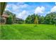 A large, well-maintained backyard provides plenty of space and features a screened pool enclosure at 9220 San Jose Blvd, Howey In The Hills, FL 34737