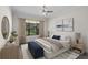 Bright bedroom featuring a neutral color palette, a ceiling fan and large windows for plenty of natural light at 9220 San Jose Blvd, Howey In The Hills, FL 34737