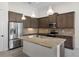 Modern kitchen features stainless steel appliances, granite countertops, and ample cabinet space at 9220 San Jose Blvd, Howey In The Hills, FL 34737
