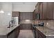 Modern kitchen features stainless steel appliances and granite countertops at 9220 San Jose Blvd, Howey In The Hills, FL 34737