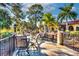 Inviting outdoor patio with ample seating and scenic views of surrounding landscaping at 9220 San Jose Blvd, Howey In The Hills, FL 34737