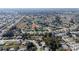 Sprawling aerial shot presenting a vast, tree-lined neighborhood with neatly arranged homes at 9430 Se 176Th Saffold St, The Villages, FL 32162
