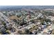 Expansive aerial view showcases the neighborhood with plentiful trees and well maintained lawns at 9430 Se 176Th Saffold St, The Villages, FL 32162