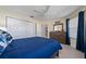 Bright bedroom with a large closet, ceiling fan, and a dresser next to a window at 9430 Se 176Th Saffold St, The Villages, FL 32162