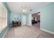 Versatile bonus room features a desk area, closet, and a view into the living room at 9430 Se 176Th Saffold St, The Villages, FL 32162