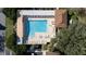 Aerial view of community pool with sunshades, ample seating and cabana at 9430 Se 176Th Saffold St, The Villages, FL 32162