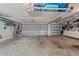 Spacious garage with ample storage and three overhead doors at 9430 Se 176Th Saffold St, The Villages, FL 32162