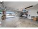 Huge garage with open door and lots of room for vehicles and hobbies at 9430 Se 176Th Saffold St, The Villages, FL 32162