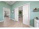 Hallway with sliding doors leading to another room and a view of the primary bedroom at 9430 Se 176Th Saffold St, The Villages, FL 32162