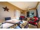 Relaxing screened-in patio with dining and seating area, perfect for enjoying the outdoors at 9430 Se 176Th Saffold St, The Villages, FL 32162