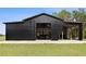 Large black barn showing the exterior with door open to the interior at 9483 Cr 747, Webster, FL 33597