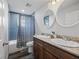 Bathroom featuring a dual sink vanity, granite countertops, and a shower-tub combo at 9483 Cr 747, Webster, FL 33597