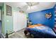The bedroom features a unique baseball-themed décor and a spacious closet at 9483 Cr 747, Webster, FL 33597