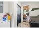 Laundry area features storage and washer-dryer with view of dining room and kitchen at 9483 Cr 747, Webster, FL 33597